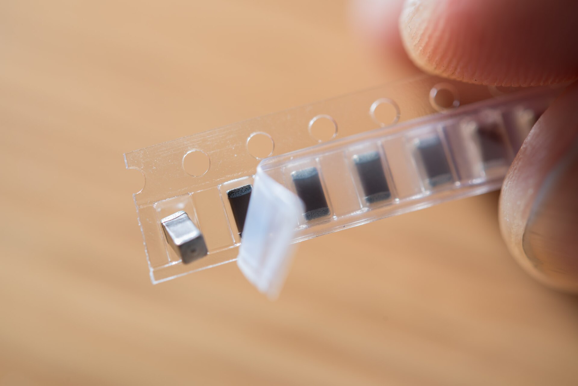 Surface-mount capacitors in their tape