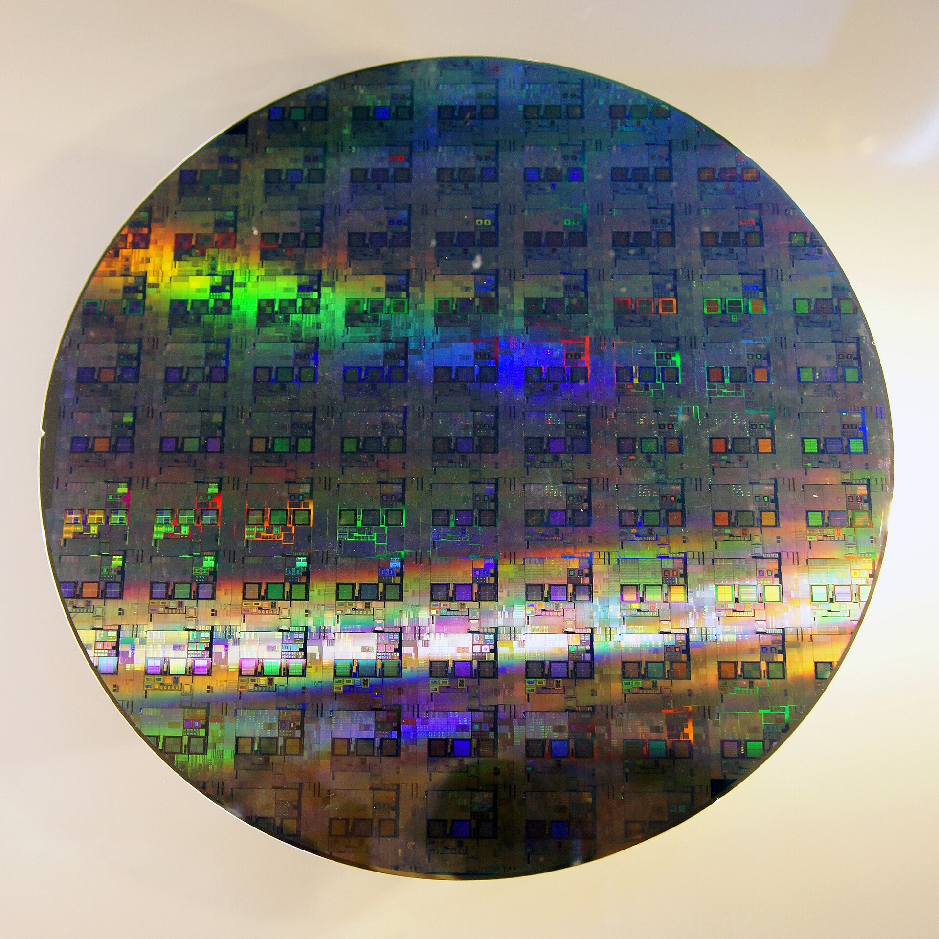 300 mm silicon wafer with its grid of chips, in negative